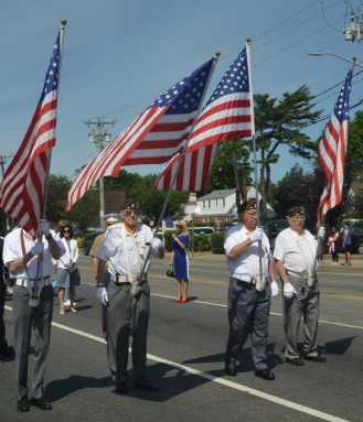 American Legion members carry flags